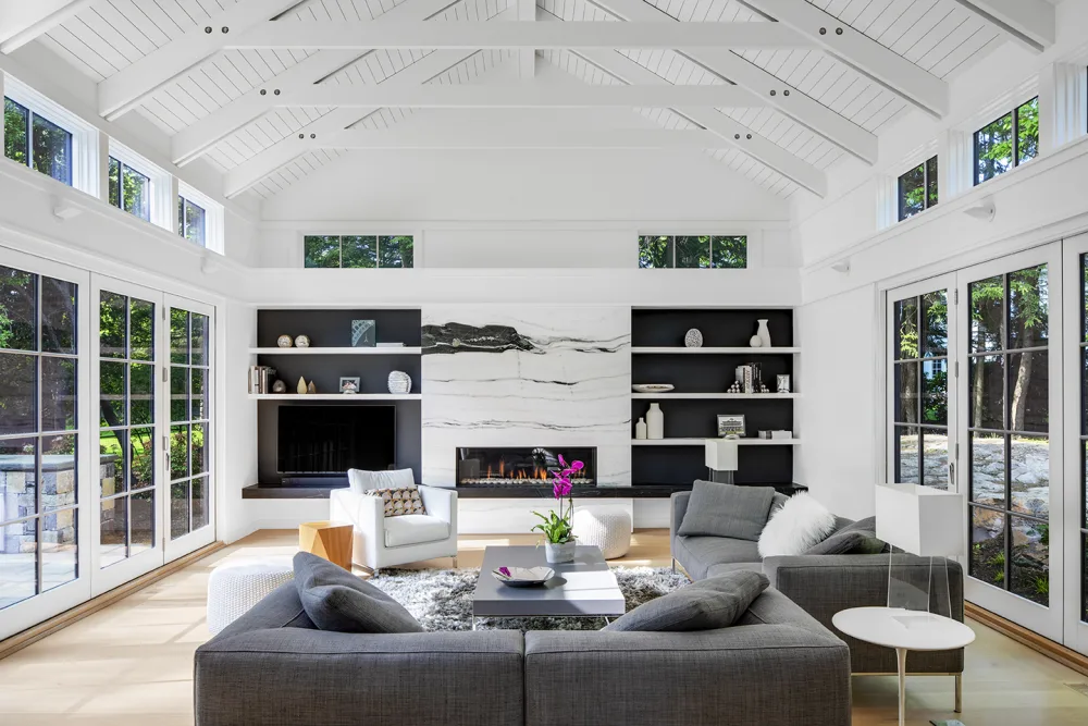 family room with cathedral ceiling and wood beams